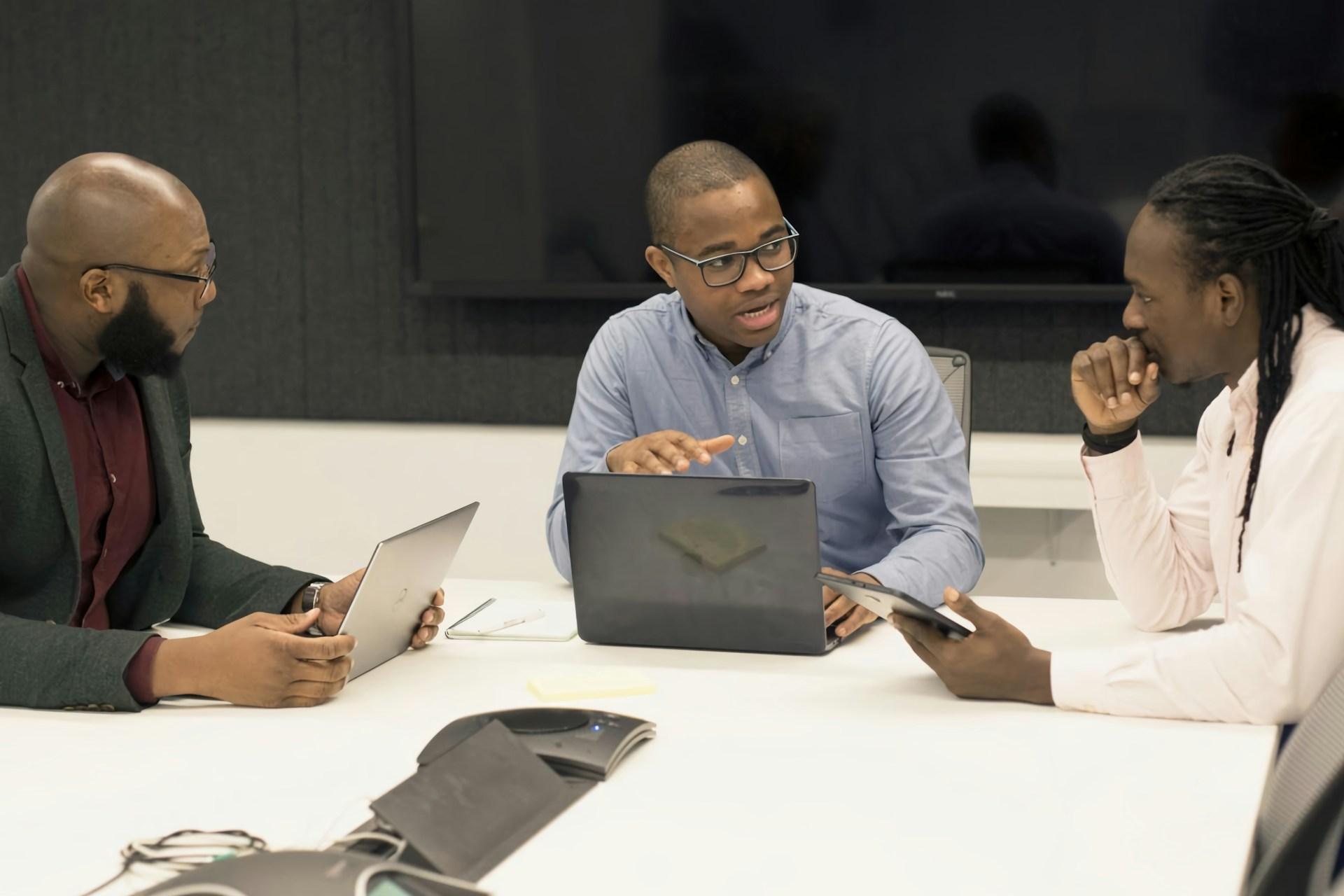 Professional software development team collaborating in modern office environment